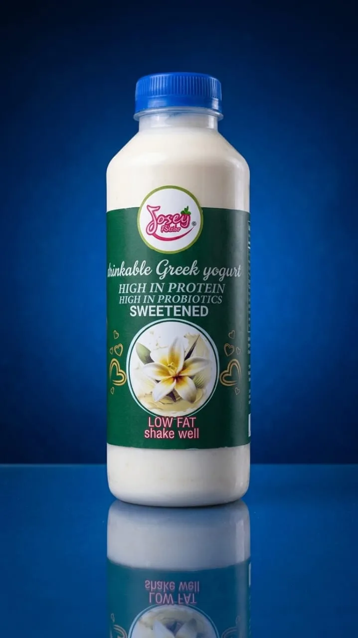A Josey Rich yoghurt drink bottle with a blue cap and green vanilla-flower label.